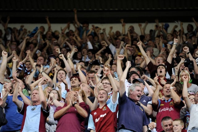BURNLEY, ENGLAND - AUGUST 19: Burnley fans celebrate the goal during the Barclays Premier League match between Burnley and Manchester United at Turf Moor on August 19, 2009 in Burnley, England