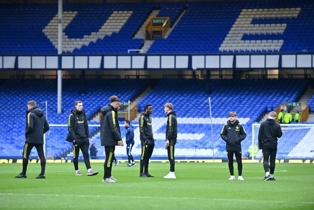 The players survey the pitch at Goodison Park.