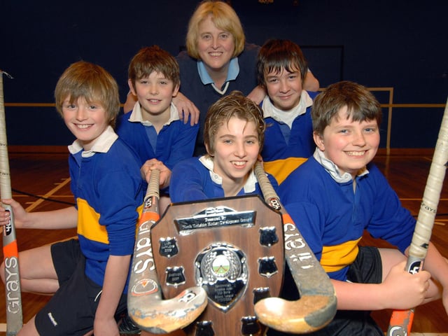 Caedmon boys hockey team bring home the trophy.