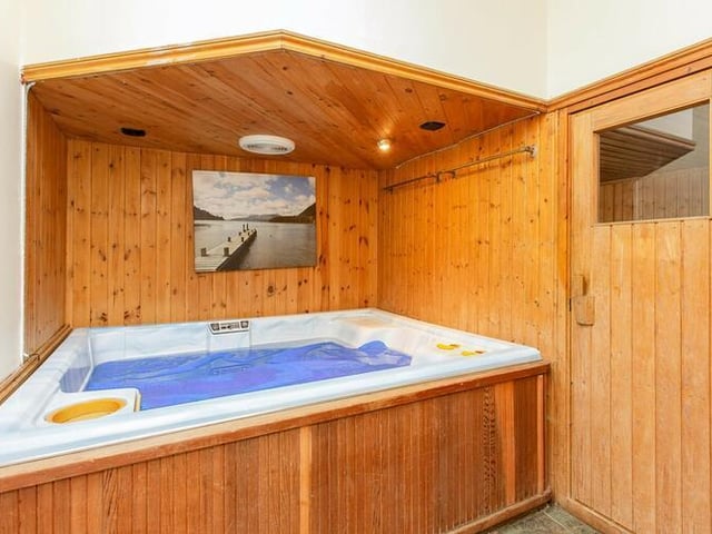 A hot tub is one of the more modern and attractive features within the character property.