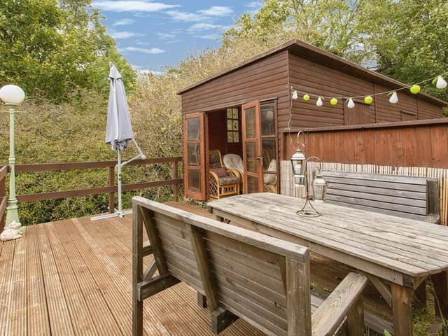 Outdoor dining on this decked area within the property's grounds.