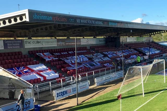 Supporters' flags on display at the PTS for the semi-final against Cheltenham Town