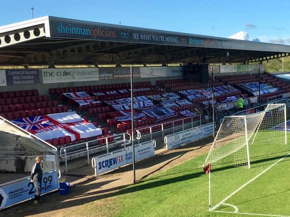 Supporters' flags on display at the PTS for the semi-final against Cheltenham Town