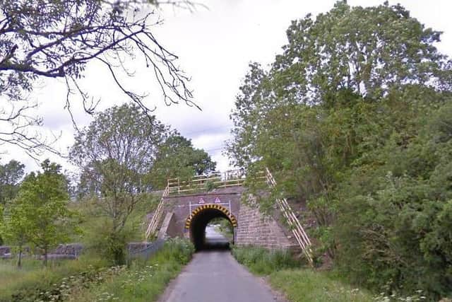 The woman was approached by two dogs while running along this footpath near Bugbrooke