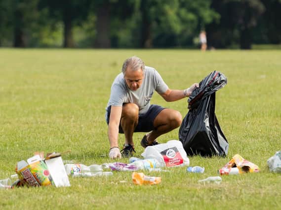 Volunteers clearing up rubbish in Abington Park