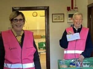 Some of the volunteers working hard to make the food parcels.