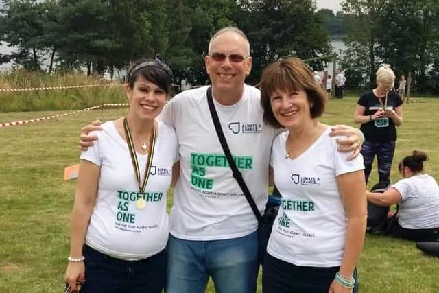 James Kouzaris' sister Emily, dad Pete and mum Hazel pictured at a previous fundraising event.