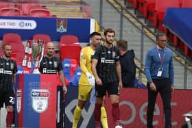 Keith Curle leads out the Cobblers at Wembley.