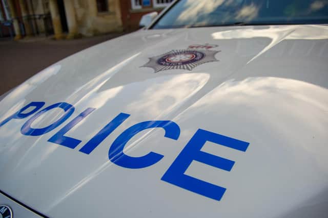 Police are hunting a cyclist following a road-race row in Duston