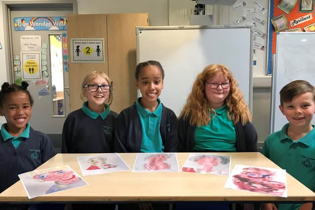 The group of youngsters from Castle Academy each designed a special portrait for The Queen.