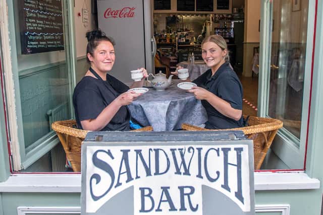 Sisters and waitresses Kerri Burton and Alana Galt of The Sandwich Bar pose for their picture on opening day in Gold Street.