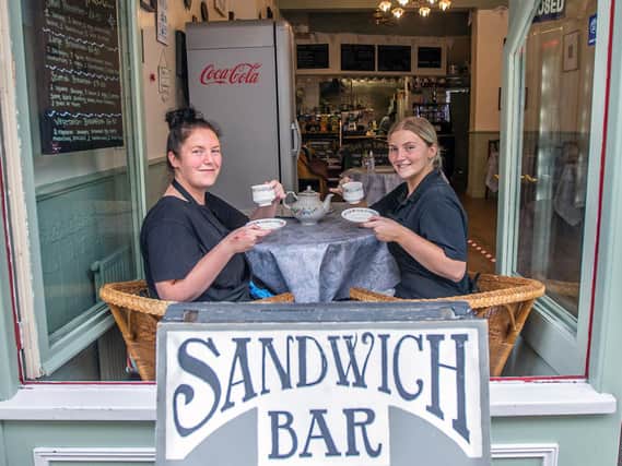 Sisters and waitresses Kerri Burton and Alana Galt of The Sandwich Bar pose for their picture on opening day in Gold Street.