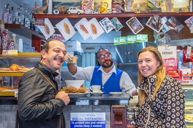 Emanuele De Palma pictured centre with two of his customers in Fish Street.
