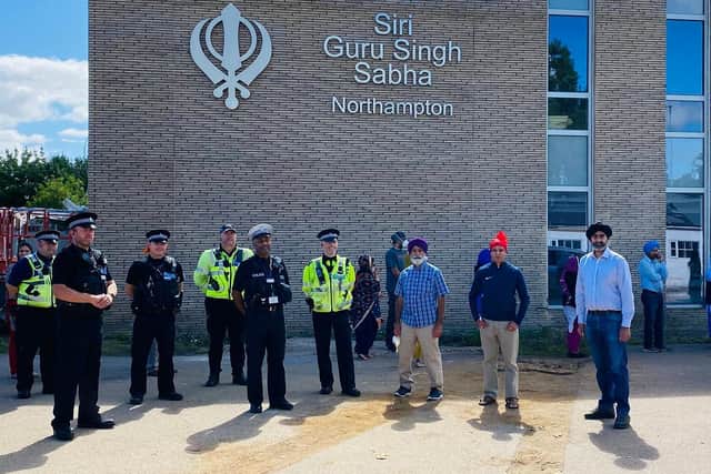The Northampton Sikh community was given a police escort to move its holy scriptures from the old gurdwara to the new one on St James Mill Road