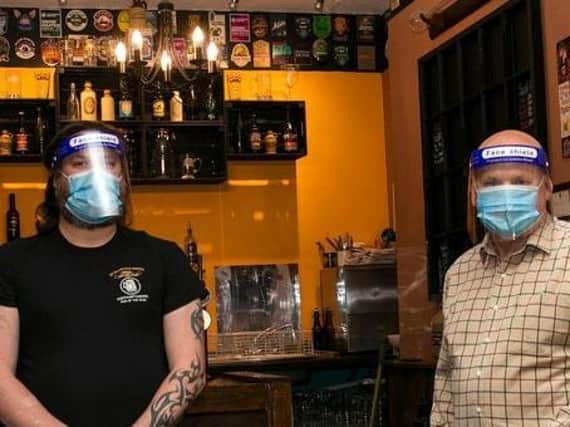 Terry Steers and his business partner Mick Willis pictured wearing PPE when the pub reopened for their takeaway service in June.
