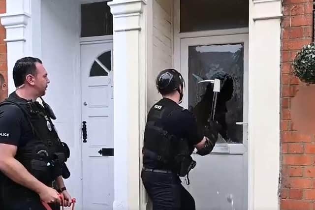 Police at one of the raids this morning