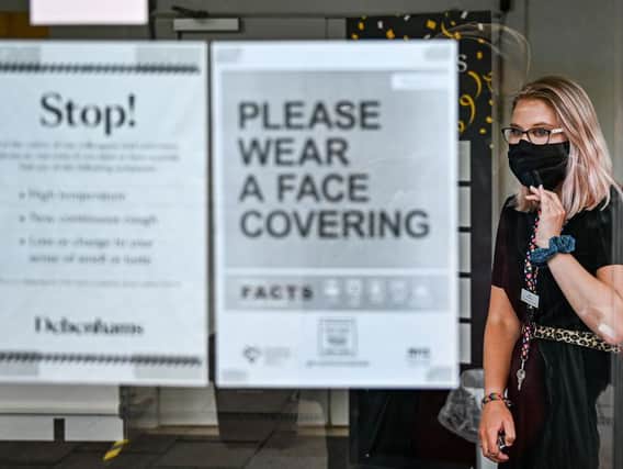 Signs as Debenhams customers to wear face coverings  but they will become mandatory on July 24. Photo: Getty Images