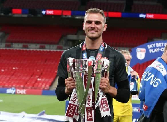 Harry Smith with the League Two play-off trophy.