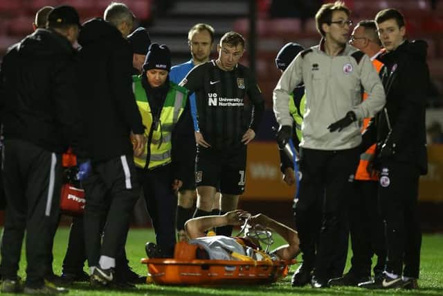 Smith was stretchered off at Crawley on Boxing Day.