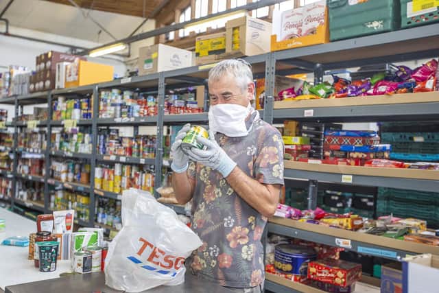 Phil Yates pictured in the warehouse where four tonnes of food is bought and distributed across the county each week. Pictures by Kirsty Edmonds.