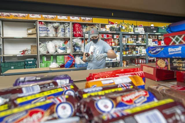 Jake Fountain helps to pack food parcels every day for delivery.