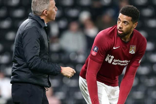 Keith Curle and Vadaine Oliver.