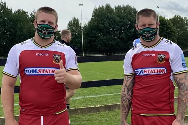 Northampton Saints players Paul Hill (left) and Teimana Harrison wearing the club's face masks