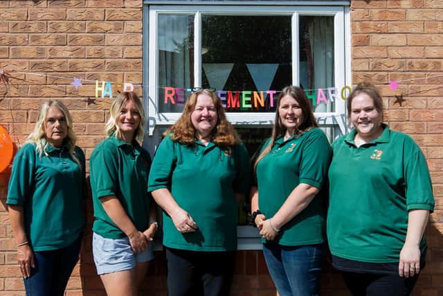 Sharon Collins (pictured centre) with her long-standing pre-school staff outside Blacky More Community Centre where the pre-school is based.
