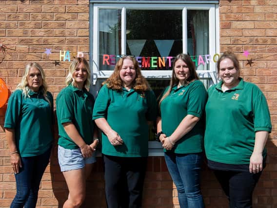 Sharon Collins (pictured centre) with her long-standing pre-school staff outside Blacky More Community Centre where the pre-school is based.