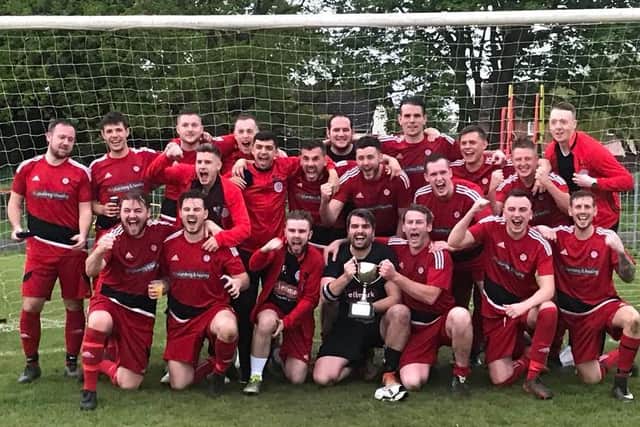 Wootton St George celebrate winning Division One in 2018