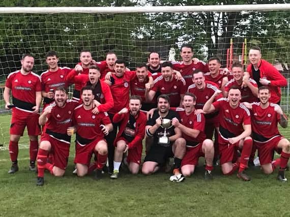 Wootton St George celebrate winning Division One in 2018