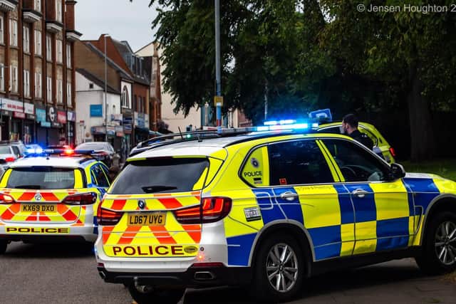 Police cars box in the stolen vehicle in Abington Square last night. Photo: Jensen Houghton