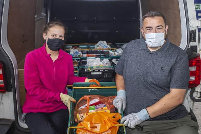 At the Hope Centre warehouse in Dallington Lucy Walker and Mark Aldridge are pictured with the free food parcels before delivery.