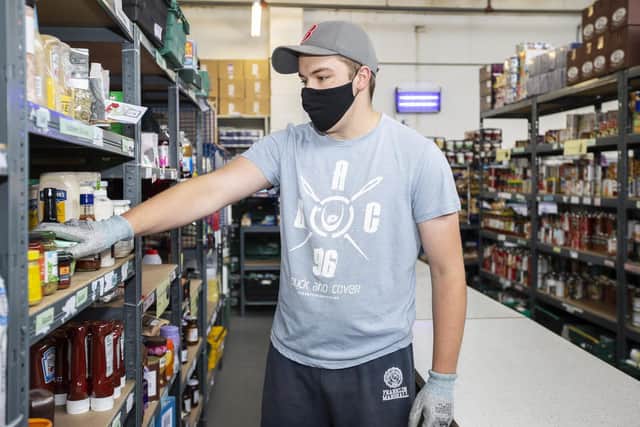 Volunteer Jake Fountain used his time off from university to lend a hand at the warehouse.