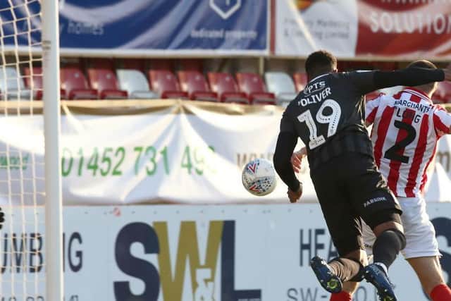 Vadaine Oliver scores in the Cobblers' play-off semi-final win at Cheltenham Town