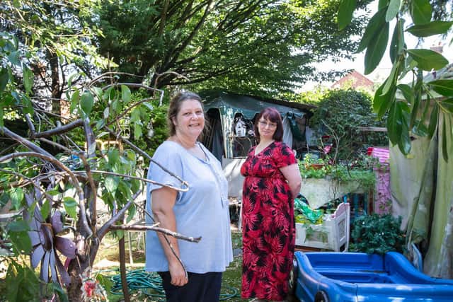 Tracey Thomas pictured in her garden with Far Cotton volunteer Helen King who is rallying round the neighbourhood for support. Pictures by Kirsty Edmonds.