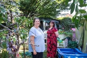 Tracey Thomas pictured in her garden with Far Cotton volunteer Helen King who is rallying round the neighbourhood for support. Pictures by Kirsty Edmonds.