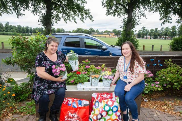 Teresa (right) bought Tracey some goodie bags and plants this morning.