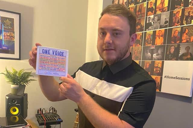 Tommy Gardner with a copy of the One Voice compilation.