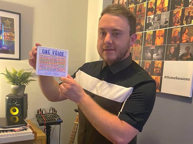 Tommy Gardner with a copy of the One Voice compilation.