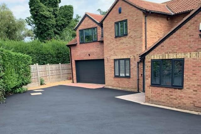 The driveway looks crisp and clean after the deep clean.
