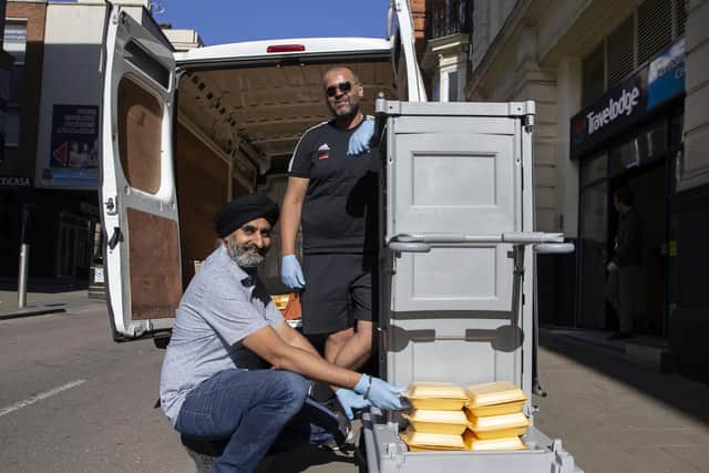 Amarjit Singh Atwal and Nav Kaul were pictured in May handing out food to the homeless at the Travelodge in Gold Street. Pictures by Kirsty Edmonds.