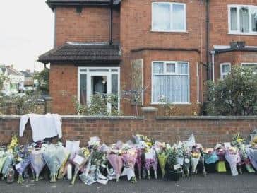 Within hours of the news spreading, floral tributes lined the street outside David's home.