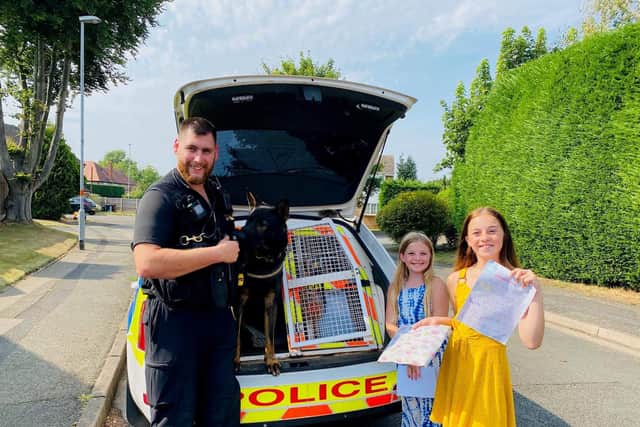 PC Kyle McGregor with PD Walt, Poppy Hyland and Gracie Hyland during their visit