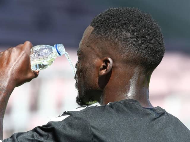 Christopher Missilou cools himself down during training earlier in the week.