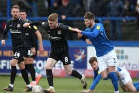 Former Macclesfield centre-back Fraser Horsfall challenges Ryan Watson during Northampton's win at Moss Rose last season.
