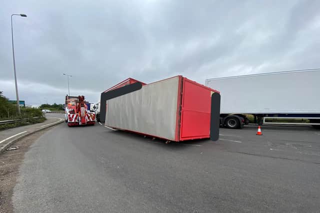 The overturned lorry is causing delays on the M1 and surrounding roads.