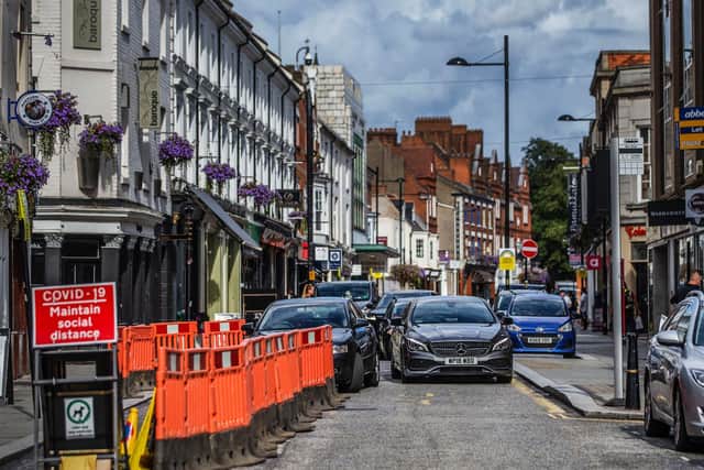 Work is underway to make the footpaths in St Giles Street COVID-secure. Pictures by Kirsty Edmonds.