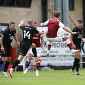 Sam Hoskins improvises brilliantly to volley home for the Cobblers on Saturday. Picture: Pete Norton