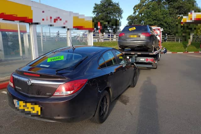 It's a two-for-one as Police tow away both uninsured cars from the Towcester garage